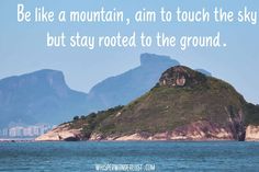 an island with mountains in the background and a quote on it that says be like a mountain, aim to touch the sky but stay rooted to the ground