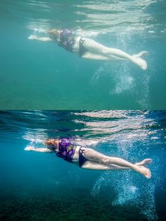 a woman is swimming in the water