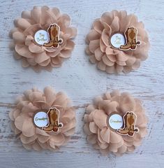 three baby cowboy themed hair clips on a white wooden background with the words cowgirl