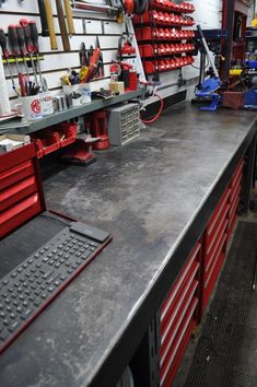 a work bench with tools on it in a garage