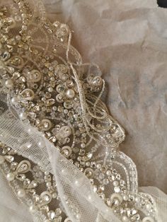 "These gorgeous bridal straps (set of 2) are made of rhinestones, pearls and beads on tulle base. They are curved shaped to give shape of cap sleeve hence can be attached to sleeveless or off shoulder gowns. The price is for a set of two pieces of the product. Dimensions: Length - 18 inches( $132) 20 inches ($136) Width at centre (from top till the bottom of hanging beads) - 3 3/4 inches Width at centre (from top till the bottom of drop shaped stone) - 3 inches Width at edge - 1/2 inch The strap Elegant Wedding Dress For Ceremony, Elegant Silver Fitted Wedding Dress, Elegant Fitted Silver Wedding Dress, Elegant Evening Wedding Dress With Rhinestones, Beaded Pearl Bridal Accessories For Wedding, Elegant Wedding Dress With Pearl Embroidery, Glamorous Embellished Wedding Dress, Fitted Embellished Bridal Accessories For Party, Elegant Embellished Lace Bridal Accessories