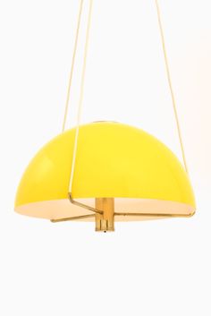 a yellow light hanging from the ceiling