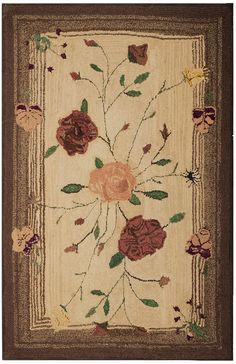 an area rug with flowers and leaves on it