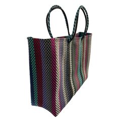 Oaxaca tote Bag, Handmade Mexican Bag, Getaways bag, Travel Bag, Basket, Beach Bag,vegan bag ,Plastic Woven, Oaxaca Bag, recycled plasticThe specifics are impressive: the bag is woven from a heavy duty, pliable plastic that is near indestructible. The weave is so tight, the bag is waterproof, which alone makes it uniqueApproximate measurements.13.5 h x 17 w x 5.5 d34 x 43 cmPlease note, since this piece is made by hand there may be some imperfections. Instead of viewing this as a mistake, let it Eco-friendly Multicolor Bag Made Of Recycled Materials, Reusable Rectangular Beach Bag For Shopping, Reusable Tote Bag Made Of Recycled Materials, Reusable Tote Bag For Market, Reusable Tote Bags Made From Recycled Materials, Eco-friendly Reusable Beach Bag For Shopping, Reusable Rectangular Bags Made Of Recycled Materials, Recyclable Shopping Bags Made Of Recycled Materials, Multicolor Rectangular Bag Made Of Recycled Materials