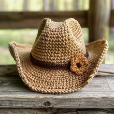 a straw hat with a flower on it