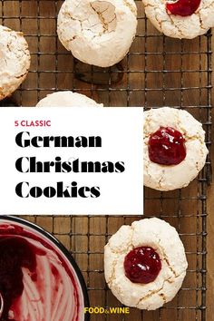 german christmas cookies on a cooling rack with jam in the middle and another cookie behind it