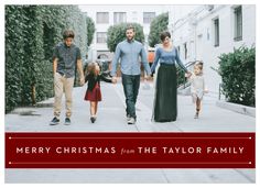 a family walking down the street holding hands and wearing christmas clothes with text merry christmas from the taylor family