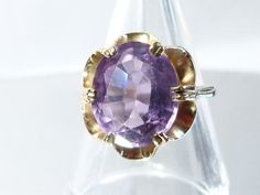 Hi everybody, I'm attempting to add videos to my listings, but they are not coming out too good but it does give you an indication of expectation of the item. HERE is a large light purple Amethyst ring. The oval facetted Amethyst is claw set into a yellow gold crown style mount, leading onto plain shoulders and shank. The Amethyst is a glorious colour of light purple with pink hues within it and this colour of Amethyst is called a Rose de France. It's a very pretty gemstone, very attractive to t Vintage Oval Solitaire Amethyst Ring, Oval Purple Sapphire Ring Hallmarked, Amethyst Engagement Ring, Gold Amethyst Ring, Amethyst Ring Engagement, Purple Amethyst Ring, Large Stone, Purple Colour, Amethyst Gem