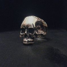 A handmade creation carved initially in wax and casted with the lost wax technic.A halfjaw anatomical skull showing lots of details of a real one ,symbol of rock since Keith Richards started to wear it being a member of Rolling Stones!No matter what your style is ,no matter what music you listen ,no matter what road you walk,this ring is an asset! Limited number of copies Sterling Silver stamped 0.925 highly polished! Availavble in all sizes ,suitable for men and women Sterling Silver Skull Rings, Silver Skull Ring, What's Your Style, Keith Richards, Skull Ring, Lost Wax, Biker Style, Favorite Rings, Style Gift