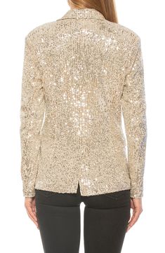 Glistening sequins add shimmer to a double-breasted blazer for a stand-out look. 27.5" length (size 2) Notched collar 90% polyester, 10% spandex Hand wash, dry flat Imported Model stats: 5'10" height, 32" bust, 25" waist, 36" hip. Model is wearing size 2. Blazer Outfits Night Out, Festive Gold Blazer For Semi-formal Occasions, Glamorous Gold Long Sleeve Blazer, Elegant Gold Sequin Blazer, Sequin Blazer Outfit, Gold Sequined Long Sleeve Blazer, Gold Sequin Blazer, Outfits Night Out, Sequin Blazer