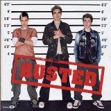 three young men standing next to each other in front of a mugshot sign that says busted