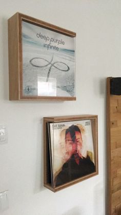 there are two pictures hanging on the wall