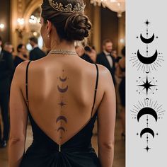 the back of a woman's dress with tattoos on her upper and lower back