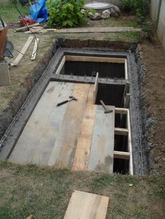 a man standing next to a hole in the ground