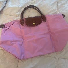 Longchamp In Pink Color Barbie Pink Pocket Book Bag Brown Handles Gold Button Black Silver Zipper 17.5 X 10.5 Brand New With Tag Classic Shopping Bags With Snap Closure, Classic Shopping Bag With Snap Closure, Pink Travel Bag With Leather Handles, Classic Pink Travel Bag, Pink Travel Shoulder Bag With Snap Closure, Pink Bags With Snap Closure For Daily Use, Pink Shoulder Bag With Snap Closure For Travel, Pink Shoulder Bag With Snap Closure For Daily Use, Classic Pink Shoulder Bag For Travel