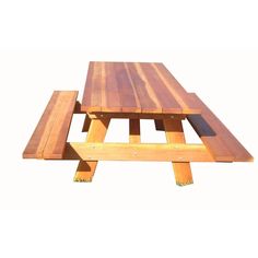 a wooden picnic table with two benches attached to it