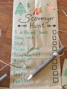 a paper bag with writing on it and some twine attached to the handle, sitting on top of a wooden table