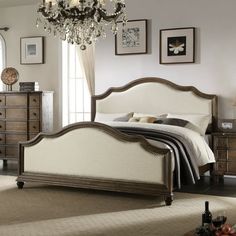 a bedroom scene with focus on the bed and dresser