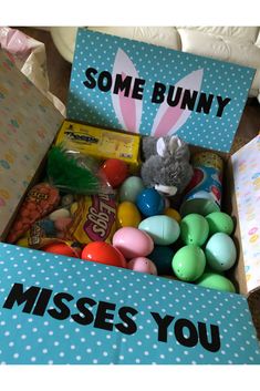 a box filled with lots of candy and some bunny