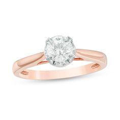 a rose gold engagement ring with a round diamond