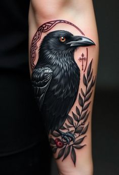 a black bird sitting on top of a person's leg