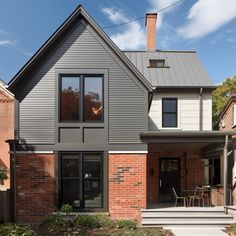 a modern house with brick and steel siding