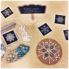 a table topped with lots of different types of snowflakes