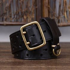 Make a fashion statement with our Osomache leather belt. Combining current trends and exceptional quality, this belt is a bold accessory that doesn't go unnoticed. Perfect for completing your style with a unique attention to detail. An essential ally to add a touch of sophistication to all your outfits. Black Leather Belt Buckle With Brass Detail, Vintage Black Belt With Brass Buckle, Luxury Adjustable Belt With Brass Buckle, Designer Leather Belt Buckles With Brass, Chic Black Belt With Brass Buckle, Designer Leather Belt Buckle With Brass, Chic Black Belt Buckles With Brass Buckle, Chic Black Belt Buckles With Brass Detail, Designer Leather Belt Buckles With Brass Buckle