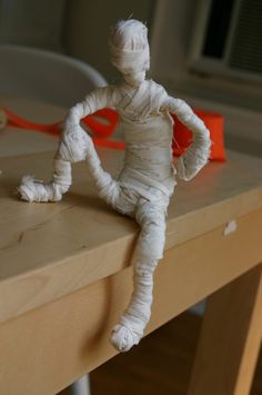 a paper mache sitting on top of a wooden table