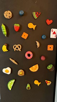 a refrigerator door covered in magnets and food