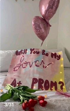 two heart shaped balloons floating over a sign that says, will you be my lover at prom?