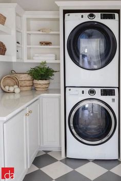 a washer and dryer stacked on top of each other in a laundry room