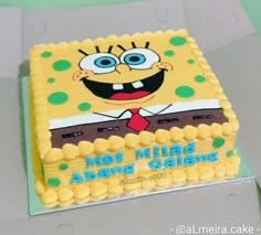 a spongebob themed cake is sitting on a table