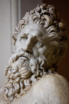 a statue of a man with long hair and beard