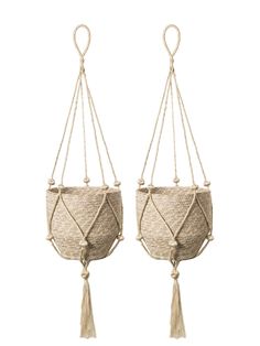 two macrame hanging planters with tassels and rope, one in beige