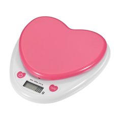 a heart shaped electronic scale on a white background