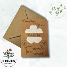 a brown envelope with some flowers on it and a card that says, friends is flower plant me that blooms in all seasons