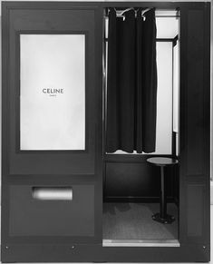 a black and white photo of a shower stall with the name celine on it