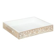 a white tray with an intricate design on it