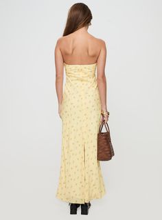 Strapless maxi dress Floral print, inner silicon strip at bust, invisible zip fastening at back, split hem at back Non-stretch material, fully lined  100% polyester  Cold gentle machine wash Maxi Dress Floral, Strapless Maxi, Strapless Maxi Dress, Dress Yellow, Invisible Zip, Dress Floral, Split Hem, Yellow Floral, Yellow Dress