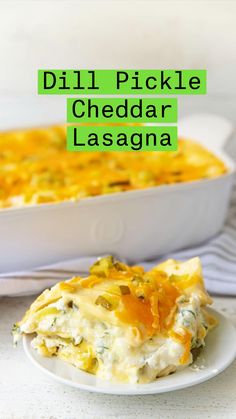 a white plate topped with a casserole covered in cheese and vegetables next to a serving dish