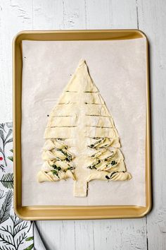 an uncooked christmas tree made out of dough