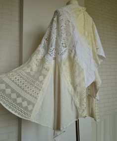 Beautiful lace wedding/special occasion cape. Large patchwork shawl/wrap made of cotton and lace. (hand crocheted doilies, cotton lace, cotton, cotton knitwear) Colors - shades: white, ecru Measurements taken flat : length : 210 cm ( 82,7 in ) width : 64-85 cm ( 25,2 - 33,5 in ) White Bohemian Shawl For Spring, Bohemian Cotton Lace Patchwork, White Lace Shawl With Lace Trim, Vintage White Shawl Scarf, Cream Bohemian Shawl For Spring, Handmade Lace Shawl In White, Handmade White Lace Shawl, Bohemian White Shawl One Size, Bohemian Cream Crochet Lace