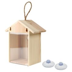 a wooden birdhouse with two glass lids and twine cord hanging from the top