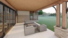 a covered patio with couches and chairs on the floor next to an open field