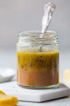 a glass jar filled with yellow and brown food