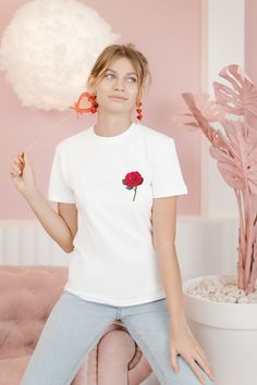 "Pocket Design Red Rose T Shirt, Gifts for Her, Real Red Rose Tee, Gifts for Flower Lovers, Funny Design Gifts, Classic Unisex Jersey Short Sleeve Tee, Valentine's Day Gifts... This classic unisex jersey short sleeve tee fits like a well-loved favorite. Soft cotton and quality print make users fall in love with it over and over again. These t-shirts have-ribbed knit collars to bolster shaping. The shoulders have taping for better fit over time. Dual side seams hold the garment's shape for longer. . : 100% Airlume combed and ringspun cotton (fiber content may vary for different colors) .: Light fabric (4.2 oz/yd2; (142 g/m2)) .: Tear away label .: Runs true to size  .   1-) Please check all the photos from the listing. 2-) Please choose your shirt style, size and color. ( It's true to size. Red Rose Print Cotton Tops, Red Cotton Tops With Rose Print, Rose Shirts, Rose T Shirt, Rose Rouge, Flower Lover, Red Rose, Pocket Design, Funny Design