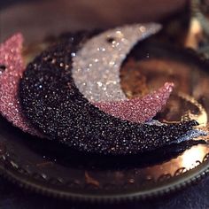 three pieces of glitter on top of a plate