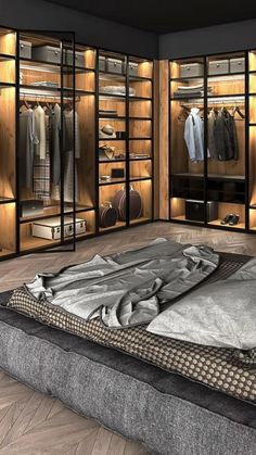 a large walk - in closet with clothes and shoes on the floor, next to a bed