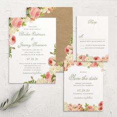 wedding stationery with flowers and greenery on the front, in shades of pink